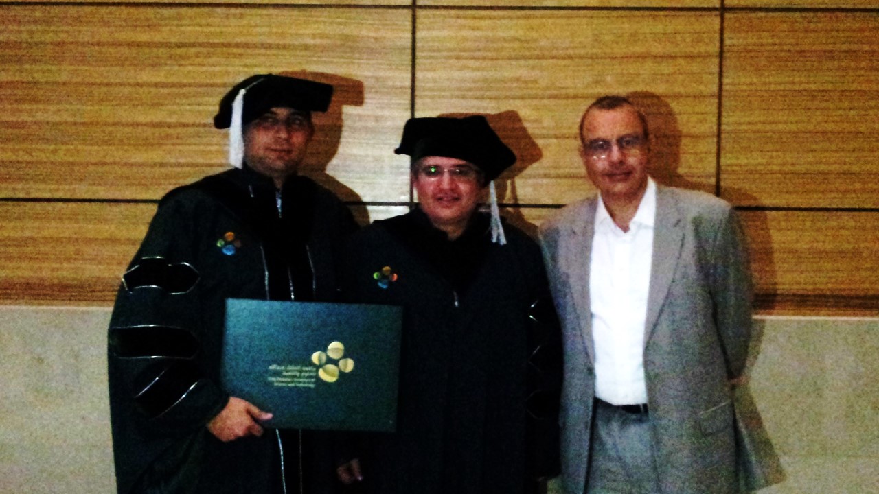 Professor Alouini with Hakim Ghazzai and Dean Mootaz Elnozahy during graduation ceremony